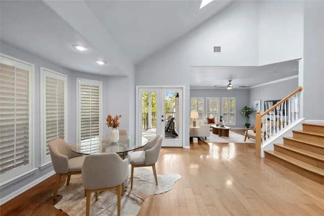 a view of a dining room with furniture window and wooden floor