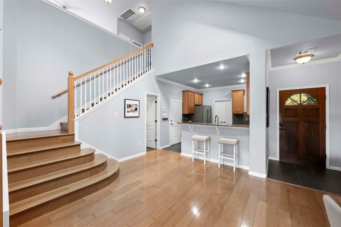 6704 Menchaca Road, Unit 29 Austin, TX 78745 - Photo 7 of 34 a view of entryway and hall with wooden floor
