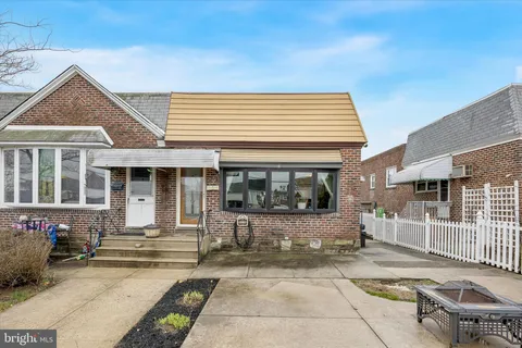 a view of a house with outdoor kitchen