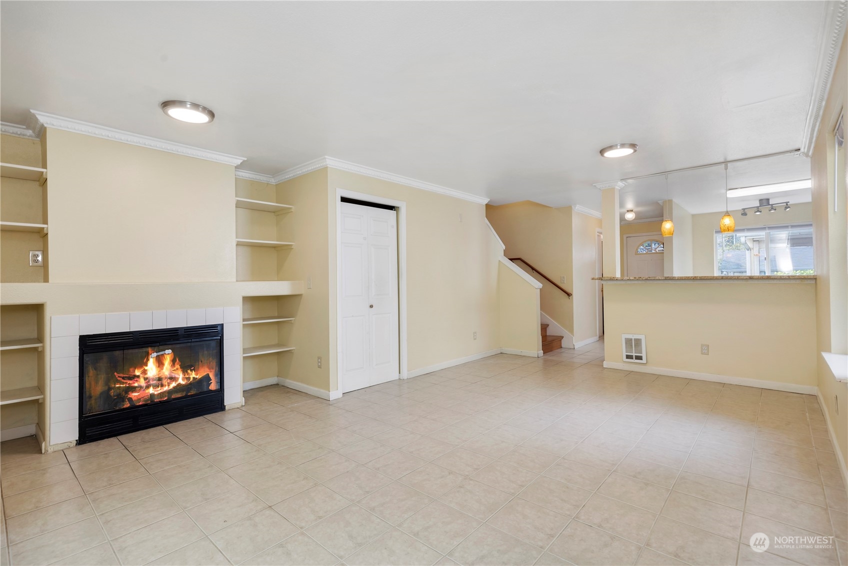 833 Southwest Sunset Boulevard, Unit M58 Renton, WA 98057 - Photo 6 of 24 a view of an empty room with a fireplace