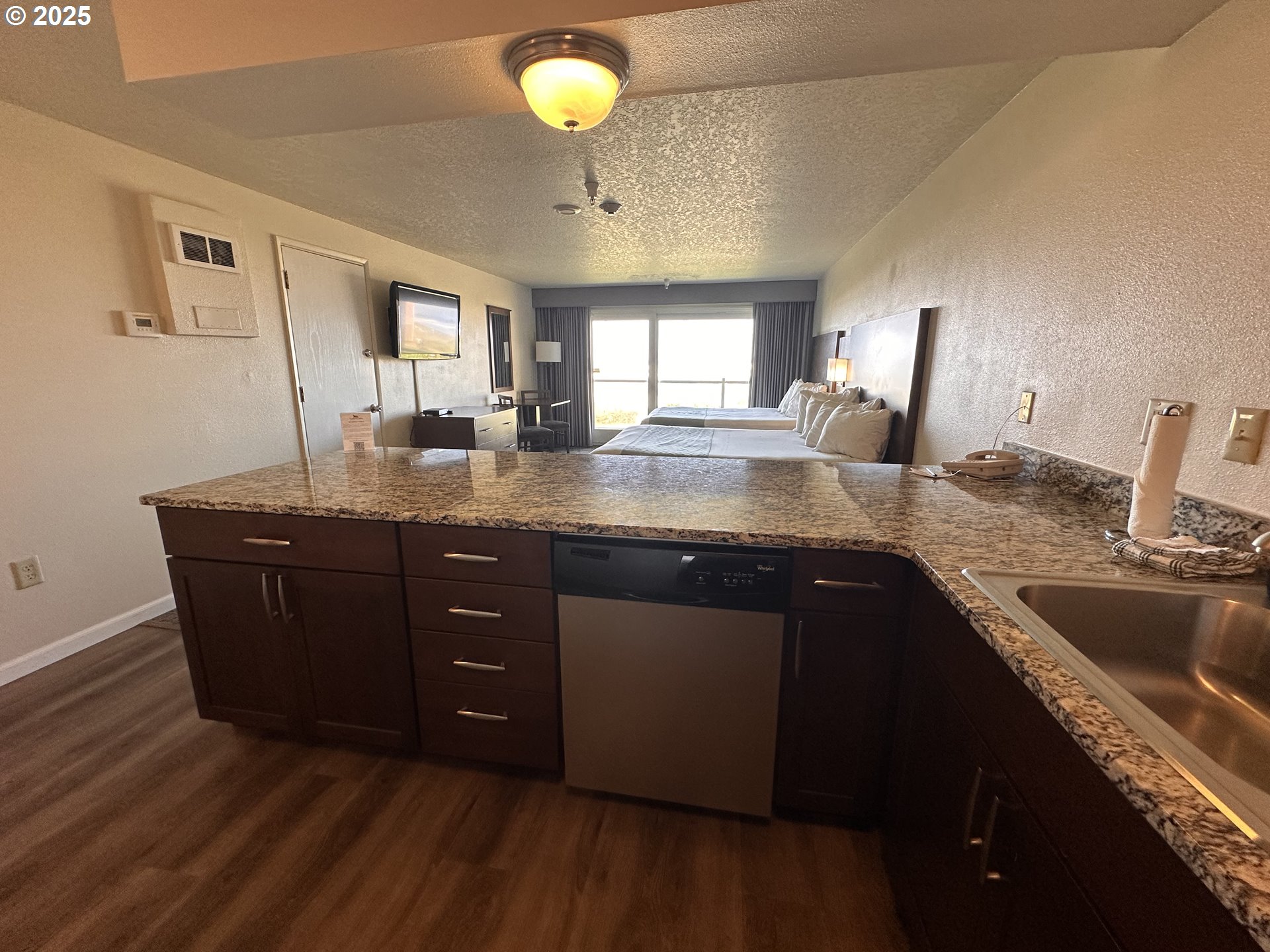 88416 1st Avenue, Unit 303 Florence, OR 97439 - Photo 8 of 21 a kitchen with a sink a counter space and a window