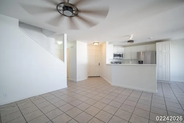 a view of a kitchen with electric appliances