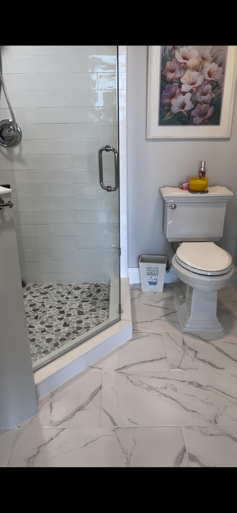 401 South Seas Drive, Unit 503 Jupiter, FL 33477 - Photo 8 of 11 a bathroom with a toilet and a shower