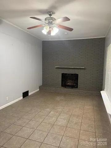 a view of empty room with fireplace