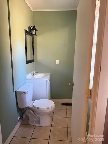 a bathroom with a toilet and a sink