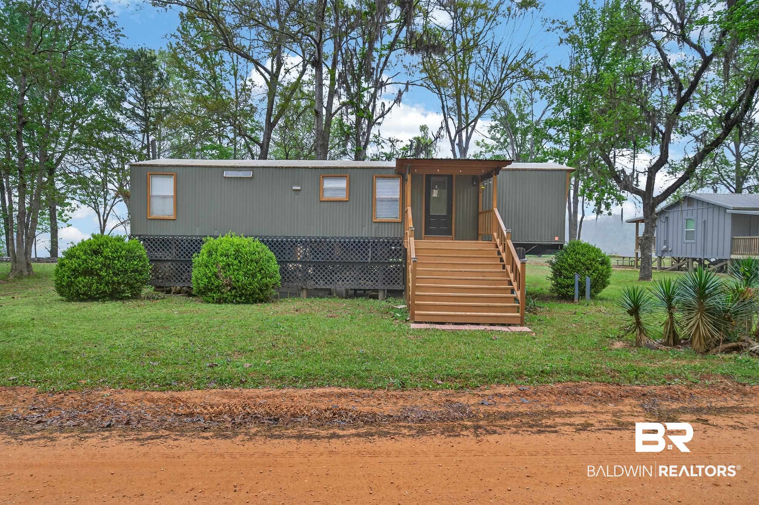 4038 Eureka Landing Road Uriah, AL 36480 - Photo 2 of 25 Manufactured / mobile home with a front yard and stairway