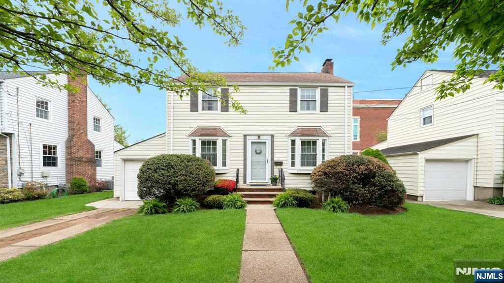 17 Brookdale Road Bloomfield, NJ 07003 - Photo 1 of 27 a front view of a house with a garden
