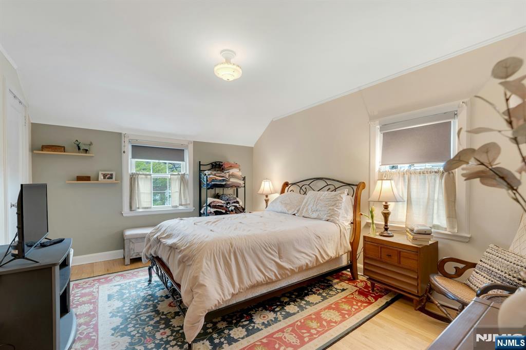 17 Brookdale Road Bloomfield, NJ 07003 - Photo 15 of 27 a bedroom with a bed and a flat screen tv
