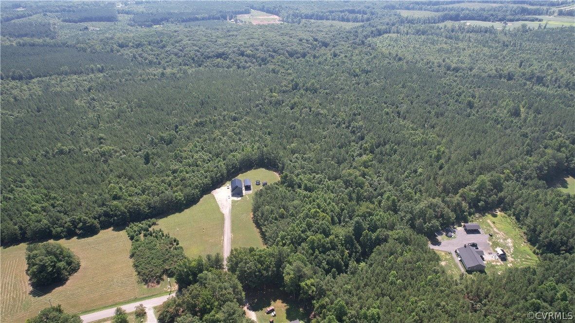 Tbd Tranquility Lane Sutherland, VA 23885 - Photo 13 of 35 a aerial view of a house with a yard and trees