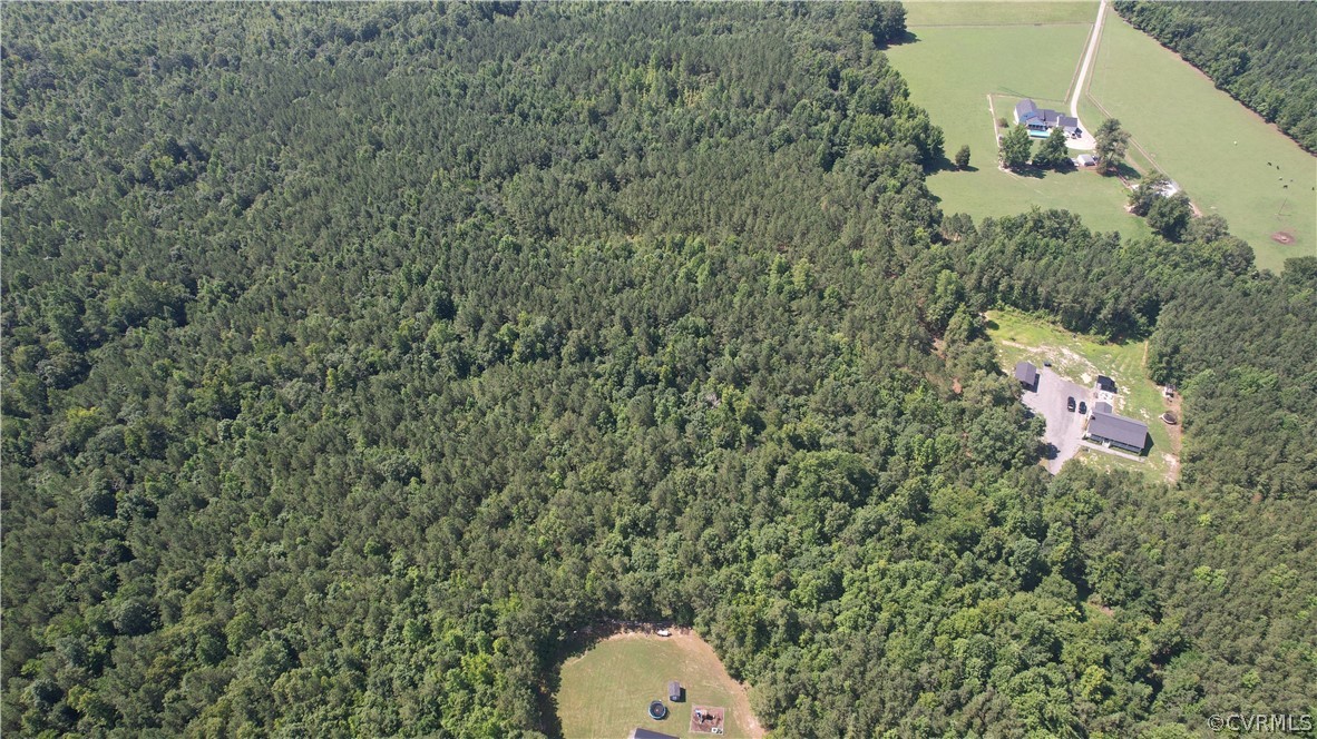 Tbd Tranquility Lane Sutherland, VA 23885 - Photo 6 of 35 a aerial view of a house with a yard and garage