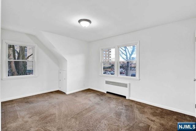 1010 Ponsi Street, Unit 2 Fort Lee, NJ 07024 - Photo 12 of 13 an empty room with windows