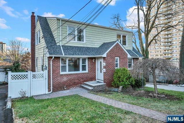 1010 Ponsi Street, Unit 2 Fort Lee, NJ 07024 - Photo 2 of 13 a front view of a house with garden