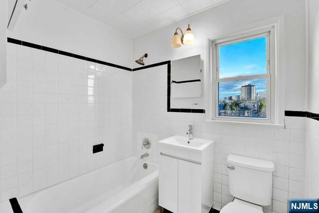 1010 Ponsi Street, Unit 2 Fort Lee, NJ 07024 - Photo 9 of 13 a bathroom with a sink a toilet and shower