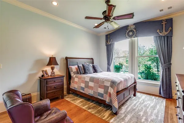 a bedroom with a bed window and couch