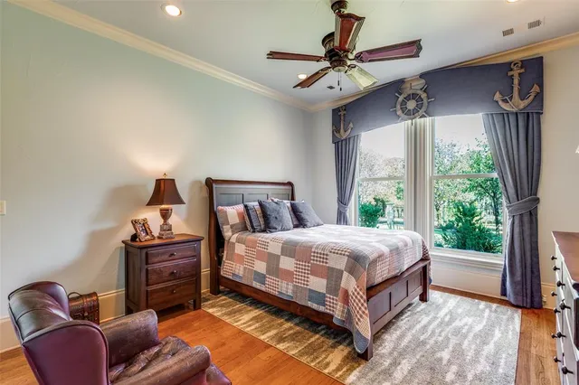 a bedroom with a bed window and couch