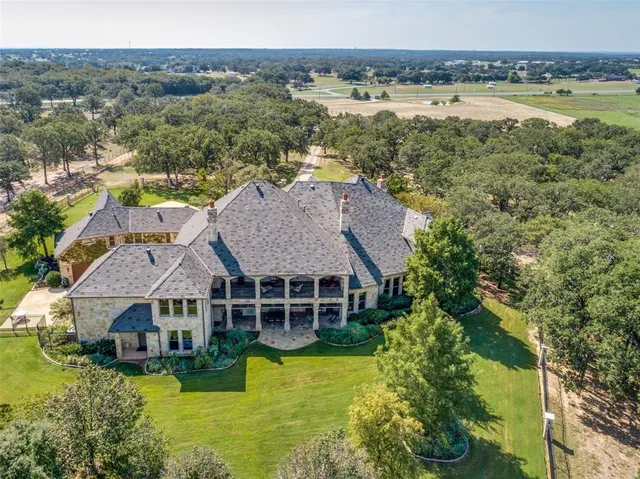 an aerial view of a house with a garden