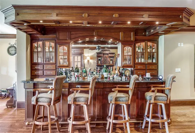 a view of a dining room with furniture and chandelier