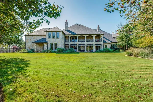 a backyard of a house with yard and outdoor seating