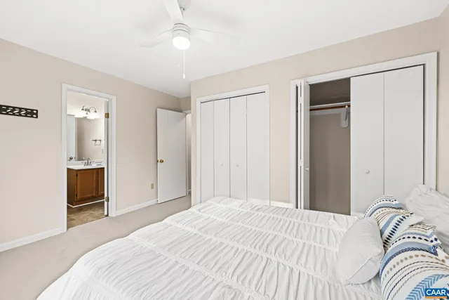 a bedroom with a bed and a sink