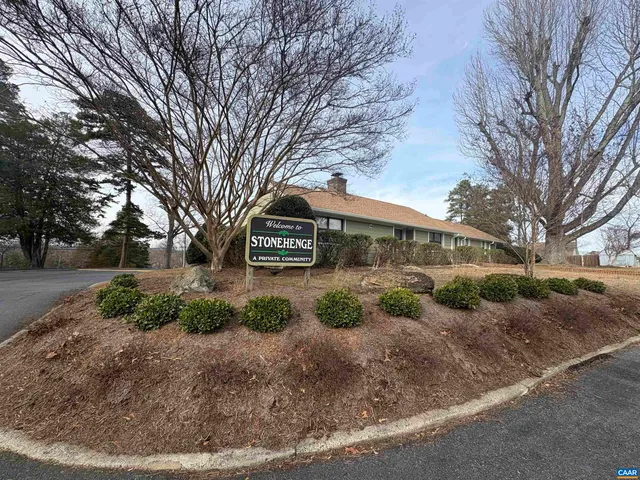 a view of a park with large trees