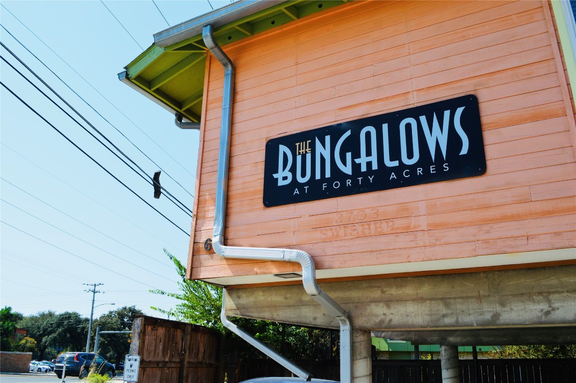 2703 Swisher Street, Unit 202A Austin, TX 78705 - Photo 1 of 14 a street sign on a brick wall