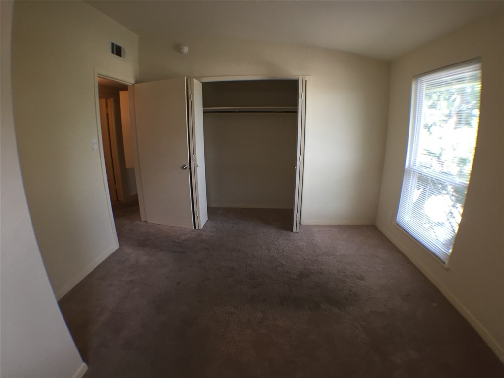 2703 Swisher Street, Unit 202A Austin, TX 78705 - Photo 11 of 14 a view of empty room with windows
