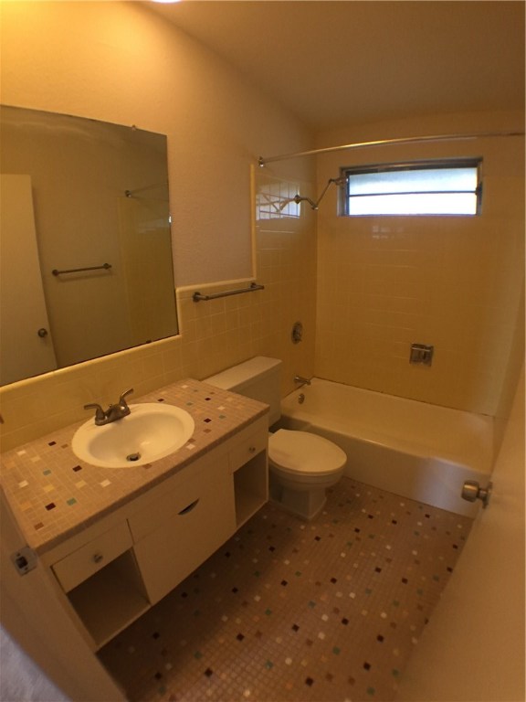 2703 Swisher Street, Unit 202A Austin, TX 78705 - Photo 12 of 14 a bathroom with a sink a toilet and shower
