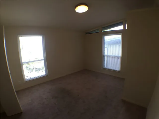 a view of empty room with windows