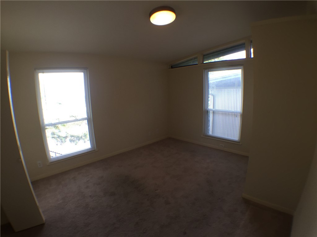 2703 Swisher Street, Unit 202A Austin, TX 78705 - Photo 9 of 14 a view of empty room with windows