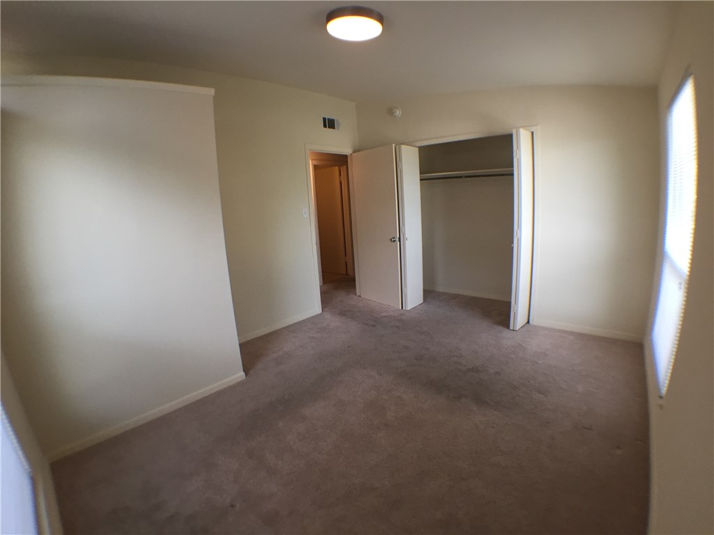 2703 Swisher Street, Unit 202A Austin, TX 78705 - Photo 10 of 14 a view of an empty room and a window