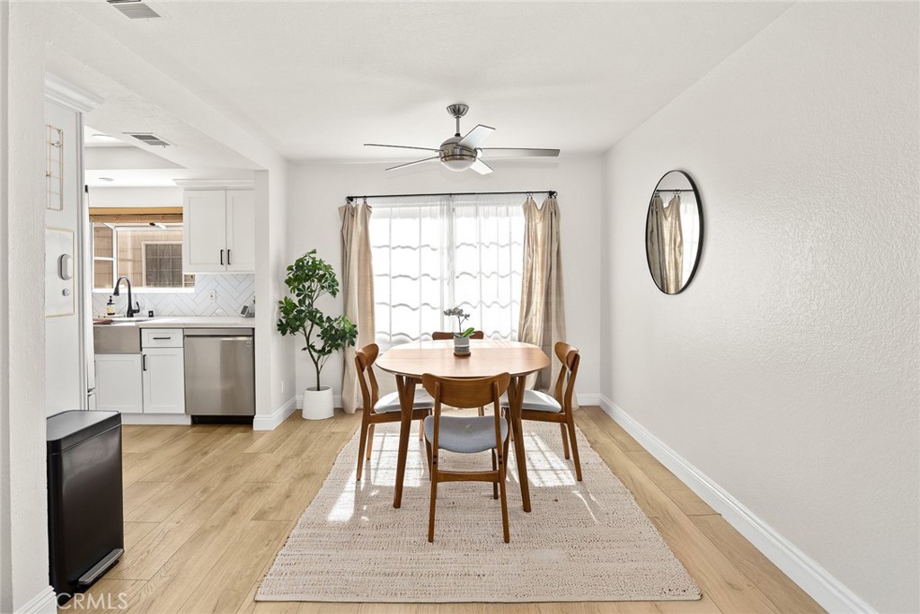 154 North Meridith Avenue, Unit 8 Pasadena, CA 91106 - Photo 11 of 31 a dining room with furniture window wooden floor