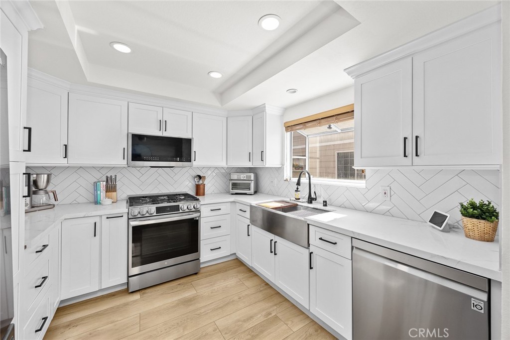 154 North Meridith Avenue, Unit 8 Pasadena, CA 91106 - Photo 15 of 31 a kitchen with sink a stove and cabinets