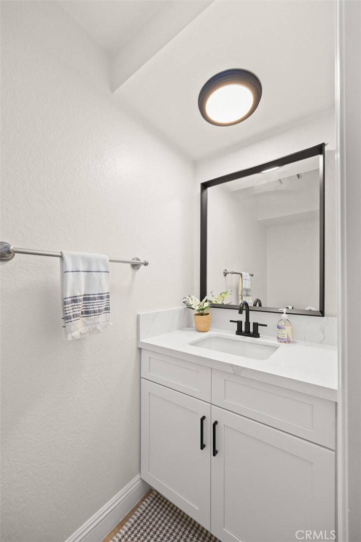 154 North Meridith Avenue, Unit 8 Pasadena, CA 91106 - Photo 17 of 31 a bathroom with a sink and mirror