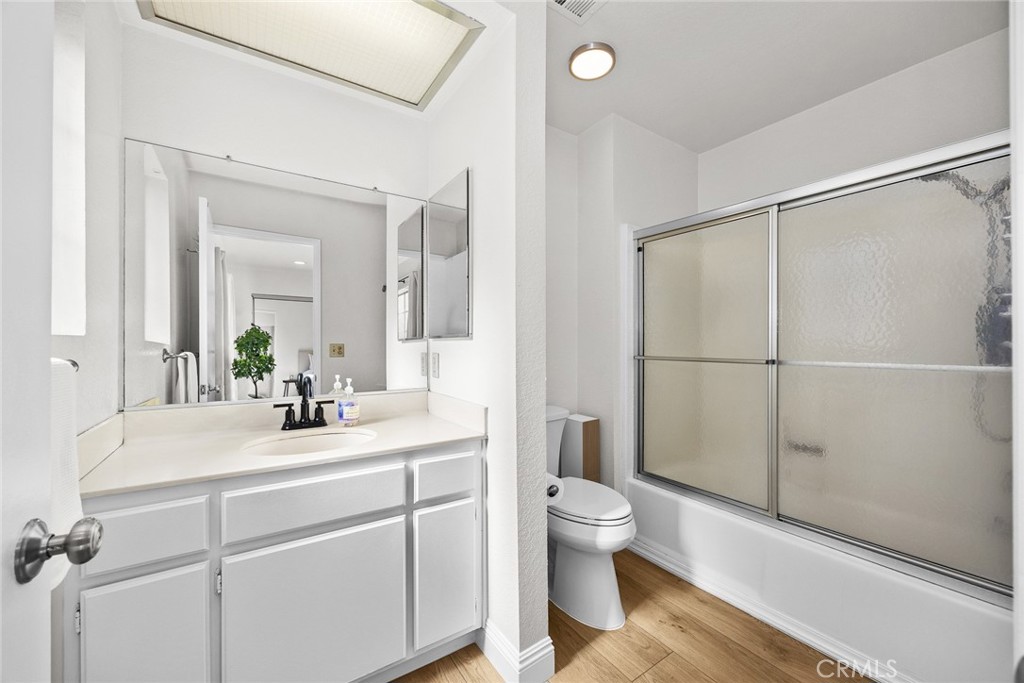 154 North Meridith Avenue, Unit 8 Pasadena, CA 91106 - Photo 20 of 31 a bathroom with a sink a toilet a mirror and shower