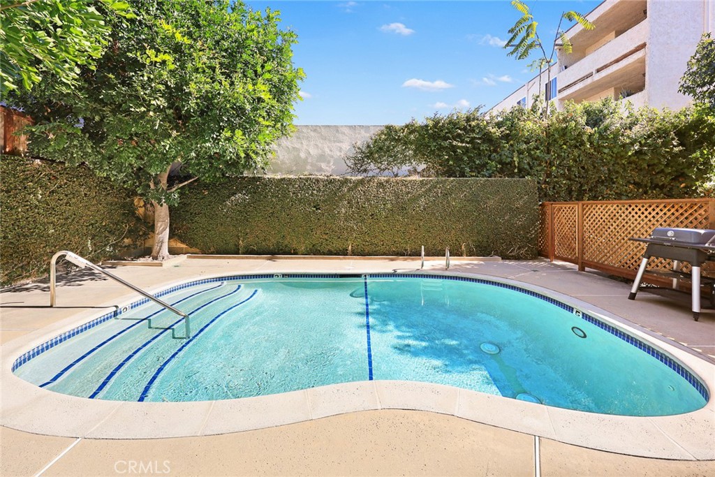 154 North Meridith Avenue, Unit 8 Pasadena, CA 91106 - Photo 29 of 31 a view of a swimming pool with a patio