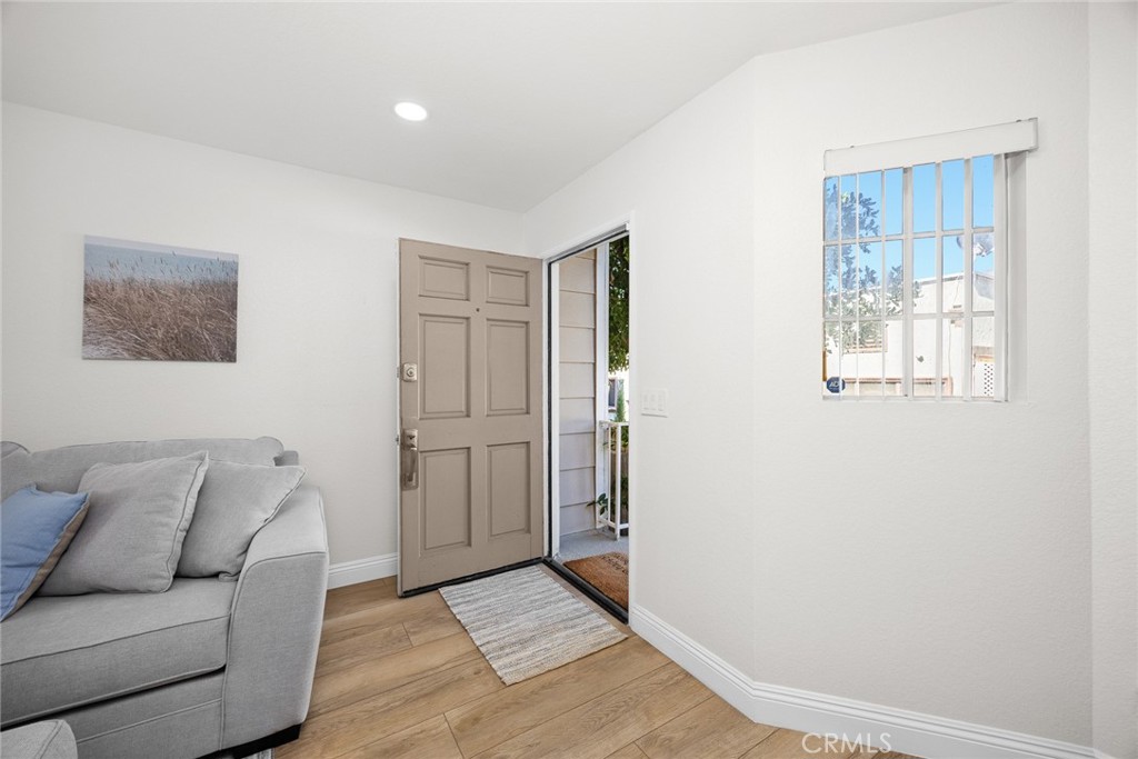 154 North Meridith Avenue, Unit 8 Pasadena, CA 91106 - Photo 5 of 31 a living room with furniture and a window