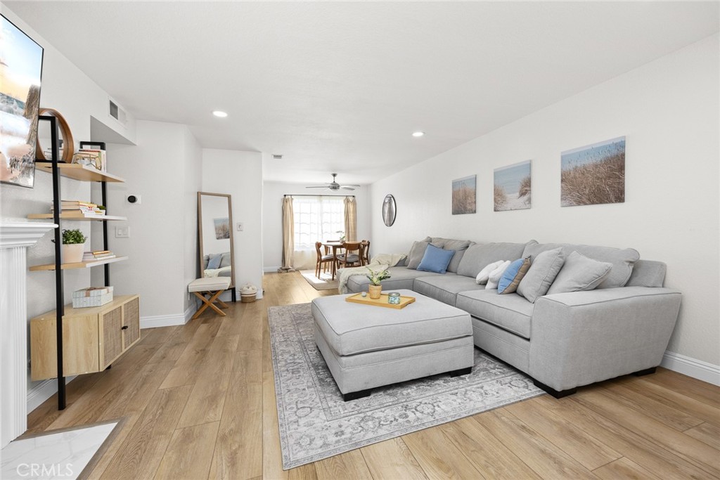 154 North Meridith Avenue, Unit 8 Pasadena, CA 91106 - Photo 7 of 31 a living room with furniture and a wooden floor