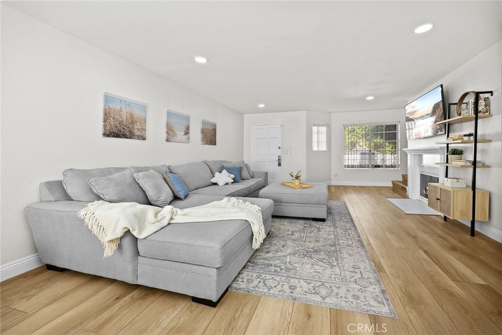 154 North Meridith Avenue, Unit 8 Pasadena, CA 91106 - Photo 8 of 31 a living room with furniture and a wooden floor