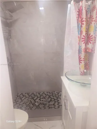 a bathroom with a sink and a toilet