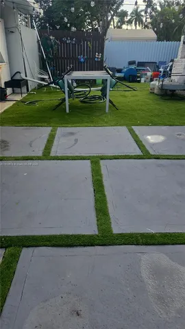 a small yard with wooden fence