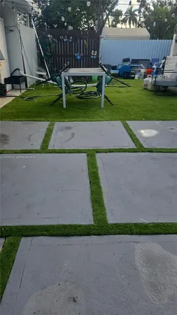 a small yard with wooden fence