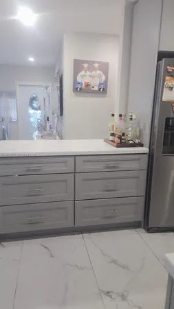 a bathroom with a mirror sink and vanity