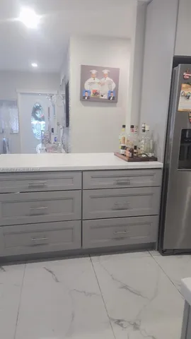 a bathroom with a mirror sink and vanity
