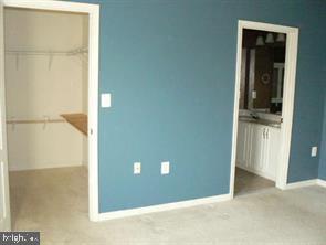 538 Rhapsody Court, Unit 538 Cockeysville, MD 21030 - Photo 18 of 30 Spacious room with vibrant blue walls.