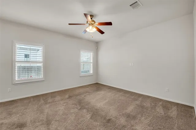 a white toilet sitting next to a white sink