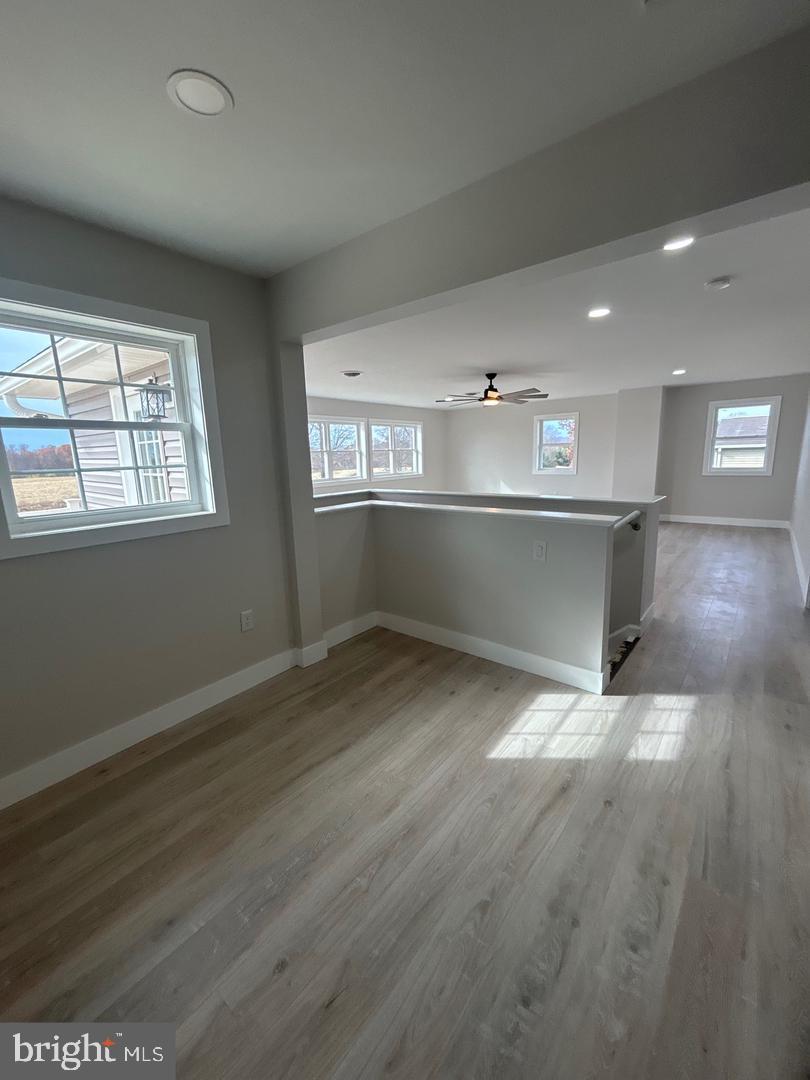 1133 Gayman Road Chambersburg, PA 17202 - Photo 12 of 33 an empty room with wooden floor and window