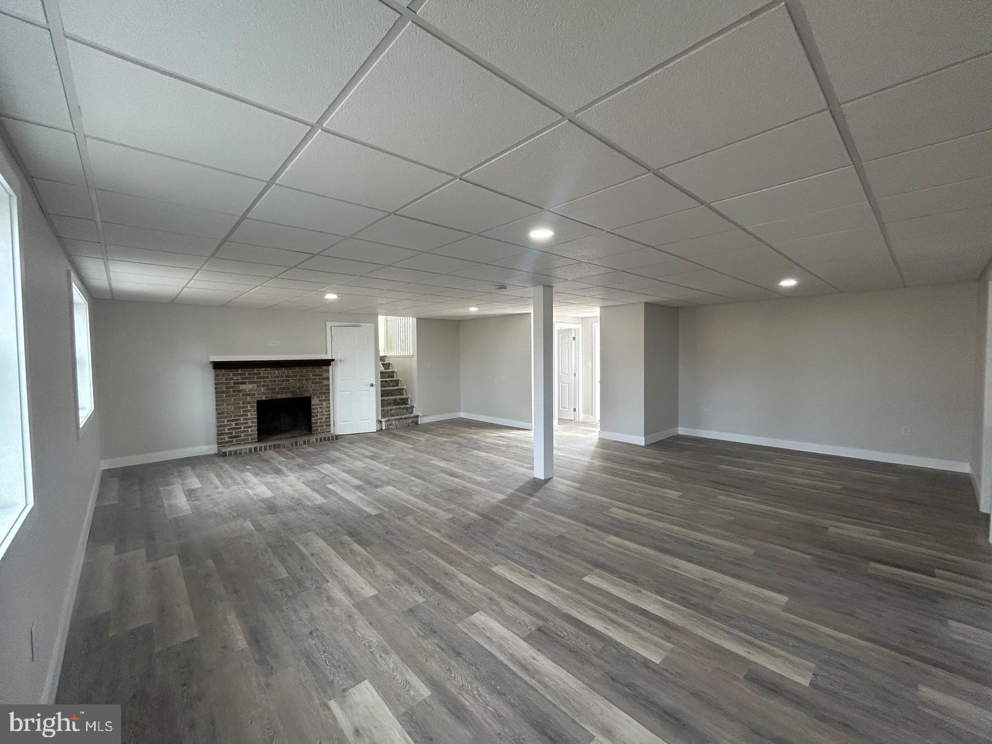 1133 Gayman Road Chambersburg, PA 17202 - Photo 23 of 33 a view of empty room with wooden floor and fireplace