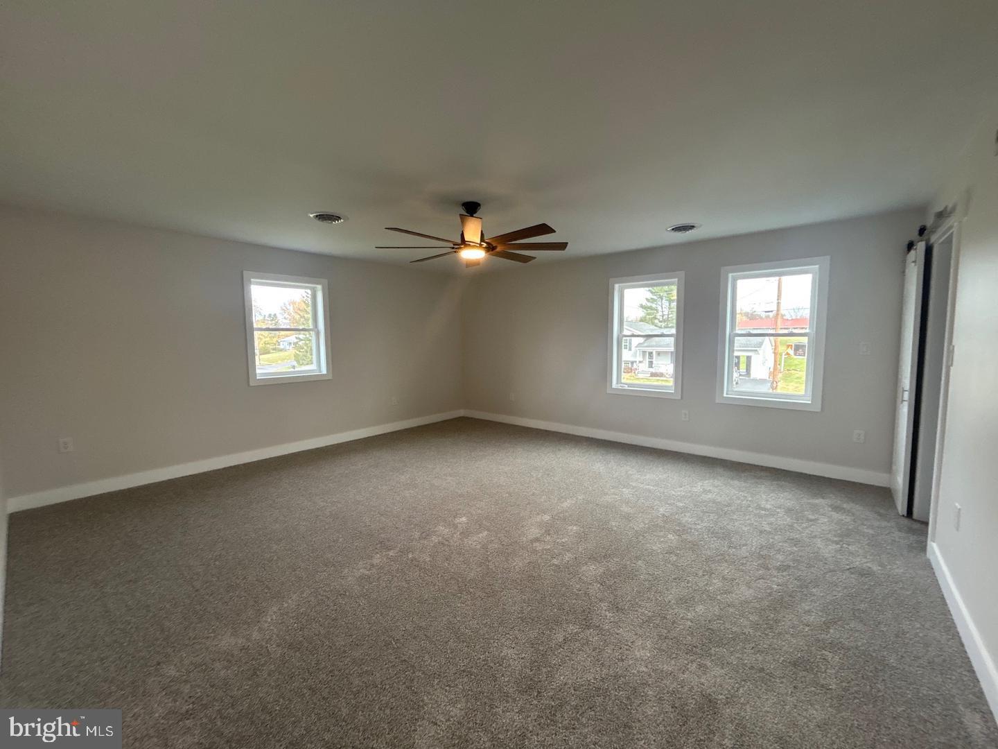 1133 Gayman Road Chambersburg, PA 17202 - Photo 7 of 33 a view of an empty room with a window