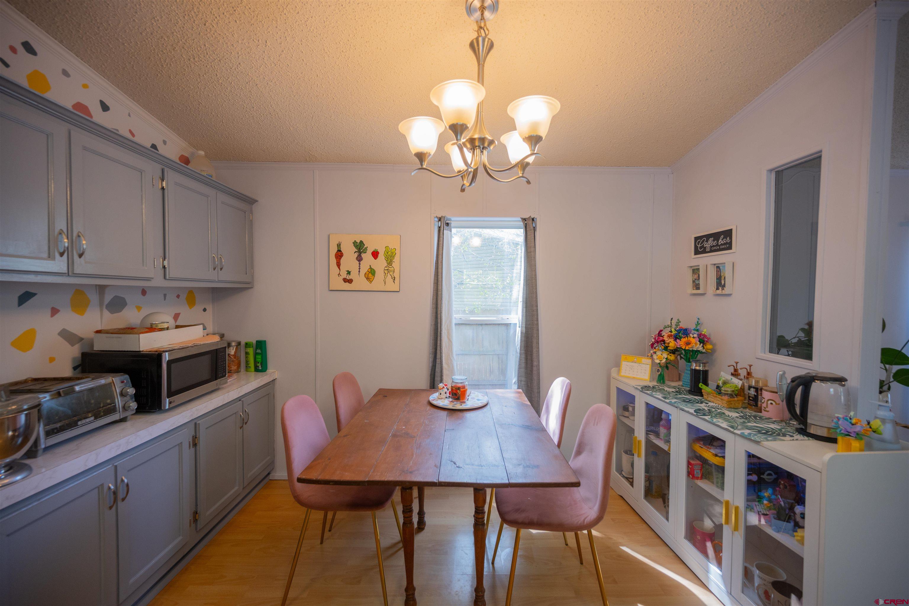 2 Mulberry Way Durango, CO 81301 - Photo 12 of 40 a view of a dining room with furniture and chandelier