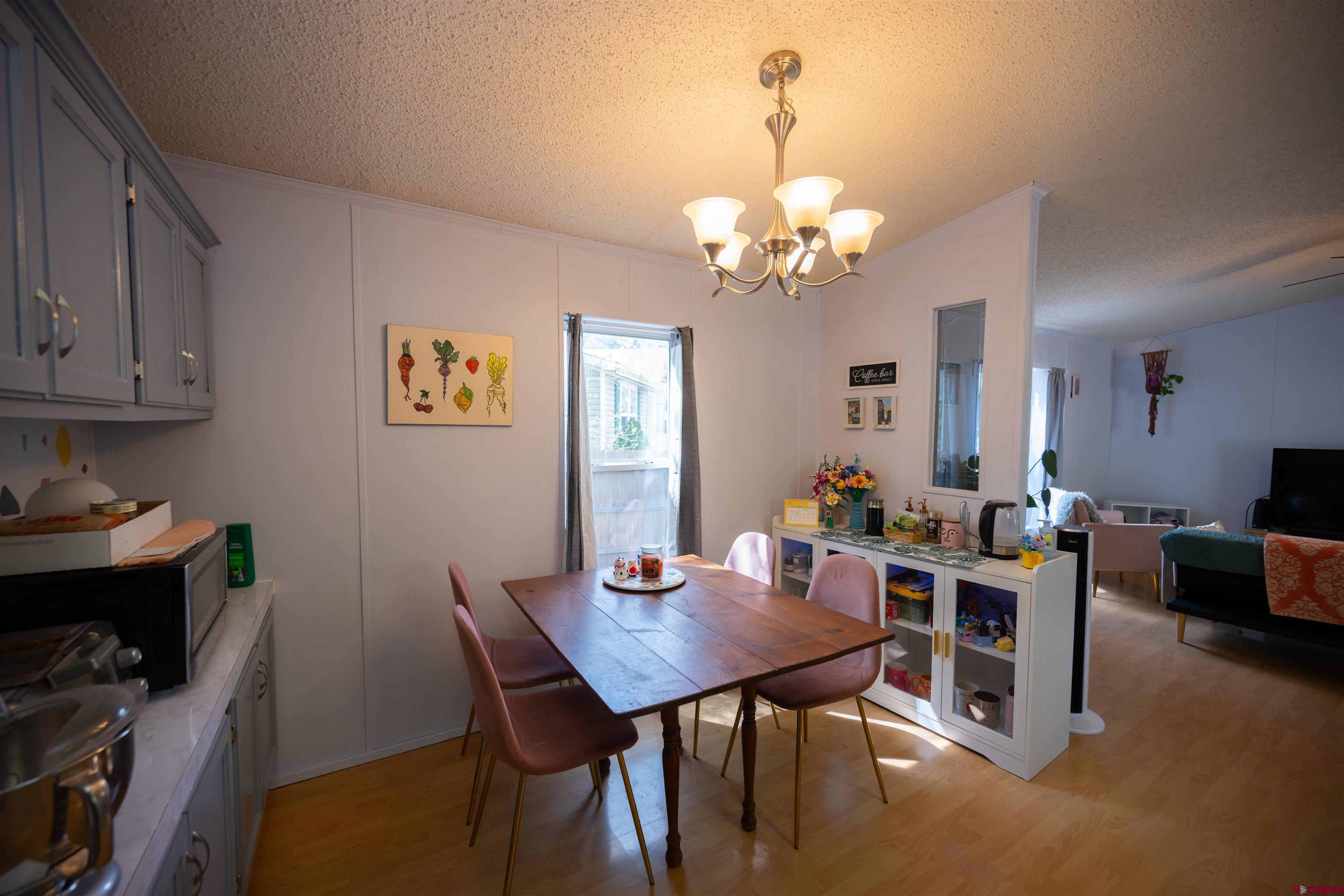 2 Mulberry Way Durango, CO 81301 - Photo 13 of 40 a view of a dining room with furniture and chandelier